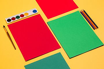 Image showing colored pencils and colour paper
