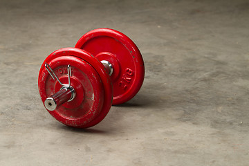 Image showing dumbbells on cement floor