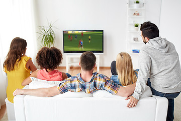 Image showing friends watching soccer game on tv at home