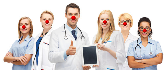 Image showing young doctors holding tablet pc in hands