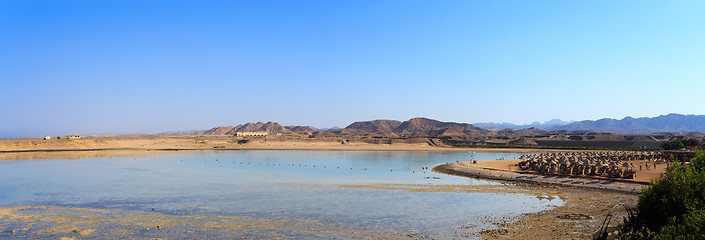 Image showing Beach sun parasol and blue sky, holliday in Egypt