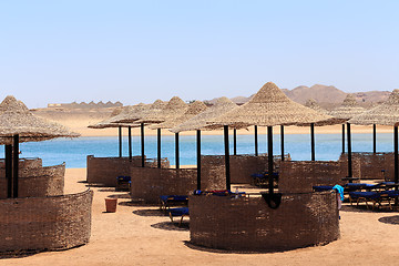 Image showing Beach sun parasol and blue sky, holliday in Egypt