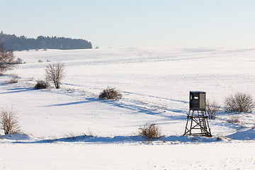 Image showing winter frozen landscape with hunting tower on highland