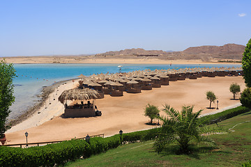 Image showing Beach sun parasol and blue sky, holliday in Egypt