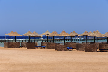 Image showing Beach sun parasol and blue sky, holliday in Egypt