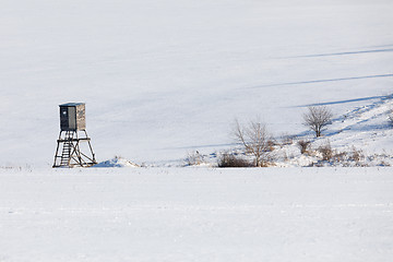 Image showing winter frozen landscape with hunting tower on highland