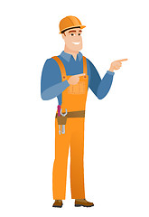 Image showing Young caucasian builder pointing to the side.