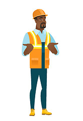 Image showing African confused builder shrugging shoulders.