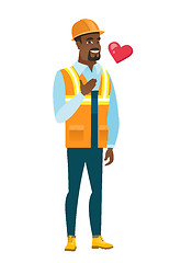 Image showing African-american builder holding hand on his chest