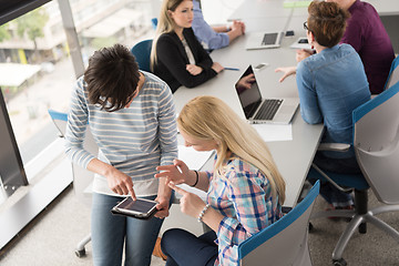 Image showing Pretty Businesswomen Using Tablet In Office Building during conf