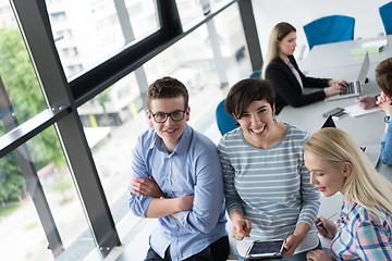 Image showing group of Business People Working With Tablet in startup office