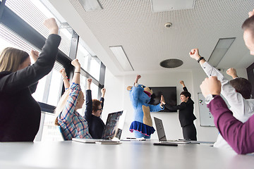 Image showing boss dresed as bear having fun with business people in trendy of