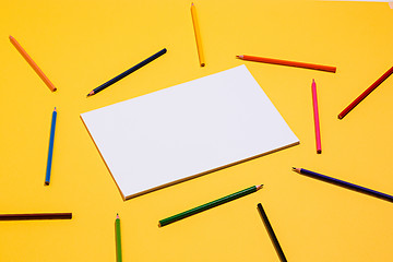 Image showing colored pencils and colour paper