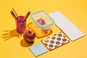 Image showing Photo of office and student gear over yellow background