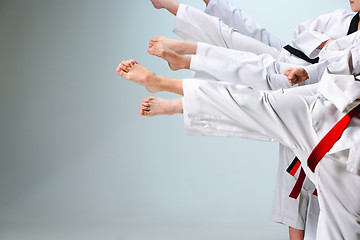 Image showing The studio shot of group of kids training karate martial arts