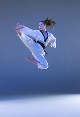 Image showing The karate girl with black belt