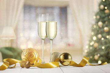 Image showing Glasses with champagne over sparkling holiday background