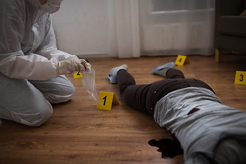 Image showing criminalist collecting crime scene evidence