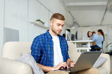 Image showing man with laptop working at office