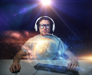 Image showing man in headset playing computer video game