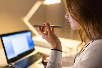 Image showing businesswoman using voice recorder on smartphone