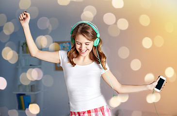 Image showing happy woman in headphones ihaving fun at home