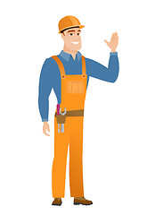 Image showing Young caucasian builder waving his hand.