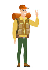 Image showing Caucasian traveler showing victory gesture.