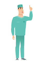 Image showing Doctor with open mouth pointing finger up.