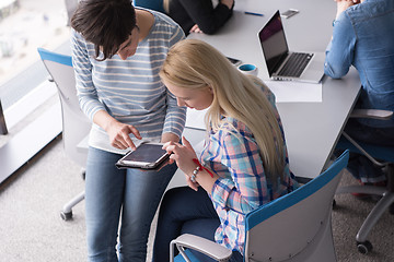 Image showing Pretty Businesswomen Using Tablet In Office Building during conf