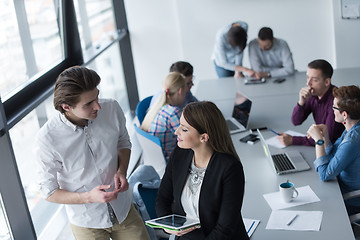 Image showing Two Business People Working With Tablet in office