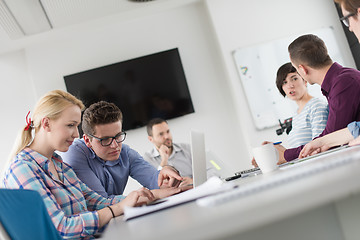 Image showing Two Business People Working With laptop in office