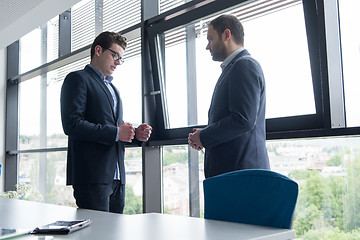 Image showing cloasing the deal in modern office interior