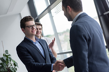 Image showing cloasing the deal in modern office interior