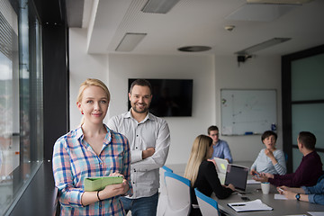 Image showing Business People Working With Tablet in startup office