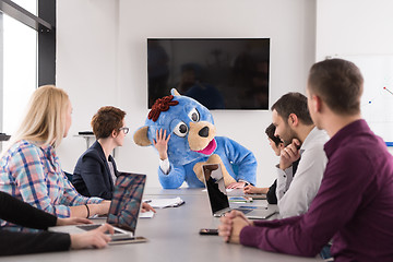 Image showing boss dresed as bear having fun with business people in trendy of