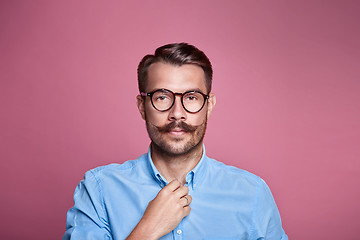 Image showing Portrait of a handsome young happy man over pink background