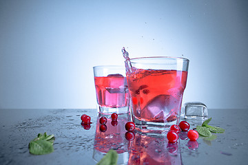 Image showing closeup of a cape cod cocktail or vodka cranberry on a blue background