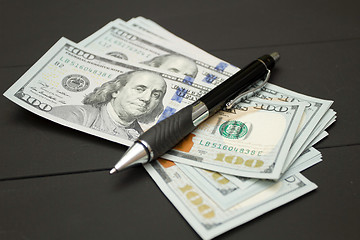 Image showing Heap of money and pen. Writer fee