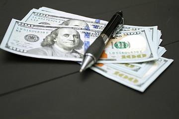 Image showing Heap of money and pen. Writer fee