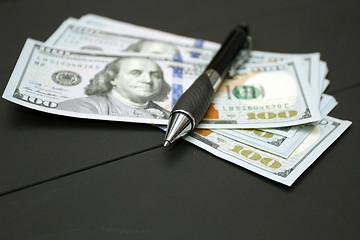 Image showing Heap of money and pen. Writer fee