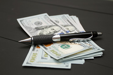 Image showing Heap of money and pen. Writer fee