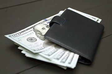 Image showing Heap of money and wallet