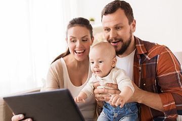 Image showing mother, father and baby with tablet pc at home