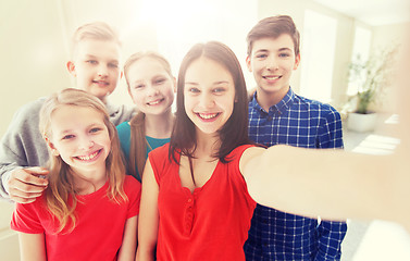 Image showing group of students taking selfie with smartphone