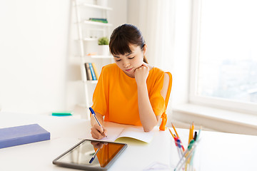 Image showing asian student girl with tablet pc learning at home