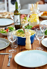 Image showing pepper mill or salt grinder on table with food