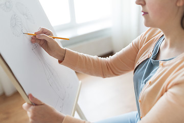 Image showing artist with pencil drawing picture at art studio