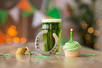 Image showing glass of beer, cupcake, horseshoe and gold coins