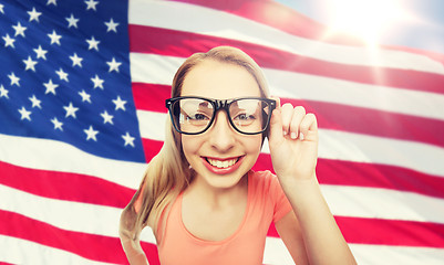 Image showing happy young woman or teenage girl in eyeglasses